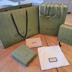 Authentic Gucci boxes, bags, ribbons and dust bags